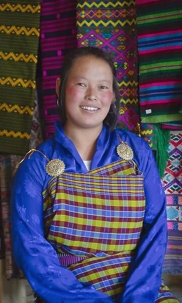 Girl with colorful fabric, Bhutan. (MR)