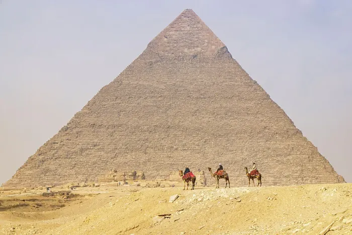 Framed Print : Giza, Cairo, Egypt. Men on camels at the Great Pyramid complex. (Editorial Use Only) Framed Print : Giza, Cairo, Egypt. Men on camels at the Great Pyramid complex. (Editorial Use Only)