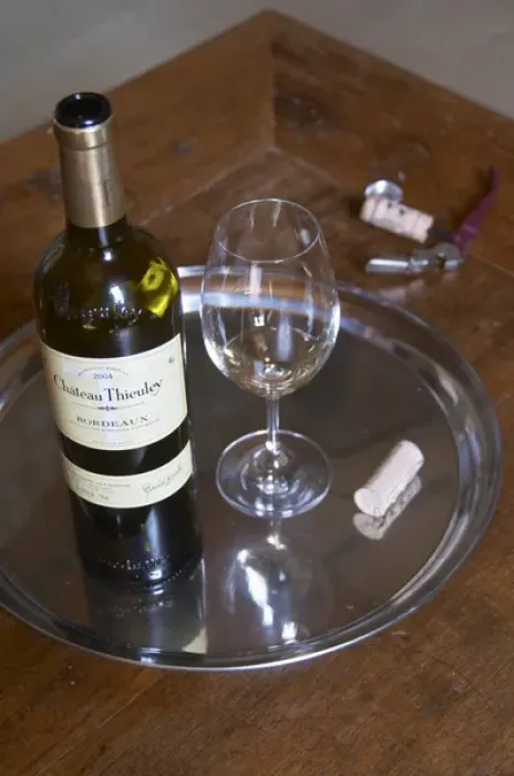 Framed Print : A glass of white vintage 2004 with the bottle and the cork and corkscrew, Chateau