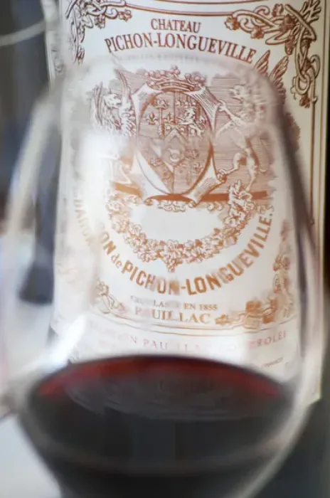 Framed Print : A glass of wine with the label of a bottle seen through the glass - label without vintage Framed Print : A glass of wine with the label of a bottle seen through the glass - label without vintage