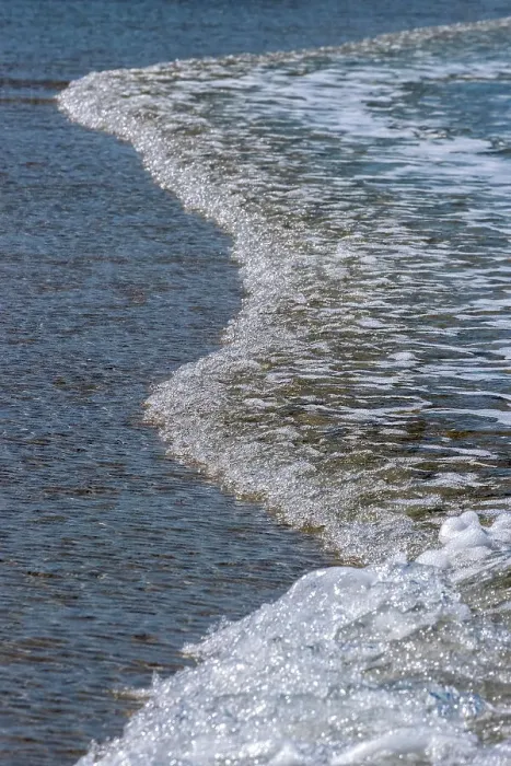 Framed Print : Glistening water washing onto the beach Framed Print : Glistening water washing onto the beach
