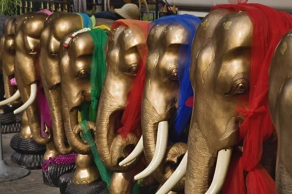 Golden elephants decorated with colorful scarves, Erawan Shrine, Bangkok, Thailand