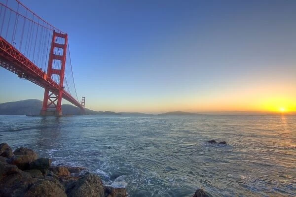 The Golden Gate Bridge at sunrise from Fort Point in San Francisco, California, USA