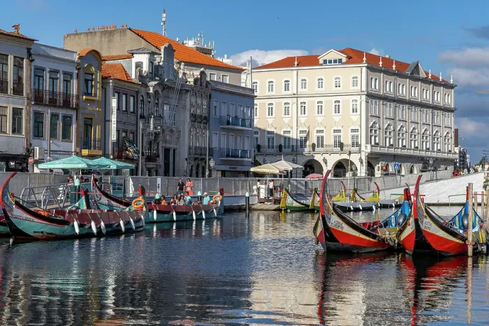 Framed Print : Gondola style fishing tour boats in canal in Aveiro, Portugal. (Editorial Use Only) Framed Print : Gondola style fishing tour boats in canal in Aveiro, Portugal. (Editorial Use Only)