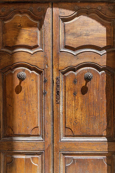 Gordes, Vaucluse, Provence-Alpes-Cote d'Azur, France. An old wooden door in Provence