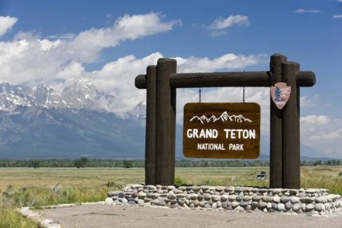 Framed Print : Grand Teton National Park welcome sign with the Grand Teton mountains in the background Framed Print : Grand Teton National Park welcome sign with the Grand Teton mountains in the background