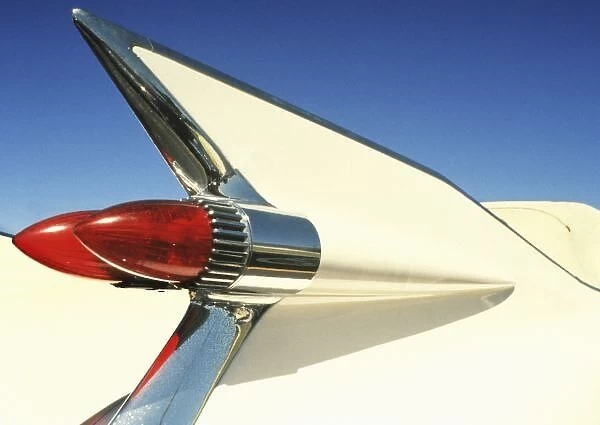 Graphic: Close-up of fin and taillight on classic car
