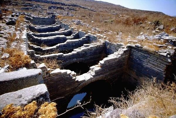 Greece, Aegean Sea, Delos. Greco-Roman water system or aqueduct ruins