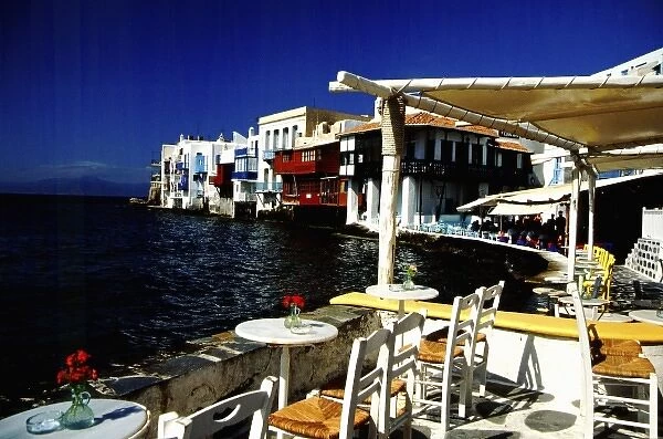 Greece, Aegean Sea, Mykonos. Seaside cafe on the Aegean Sea