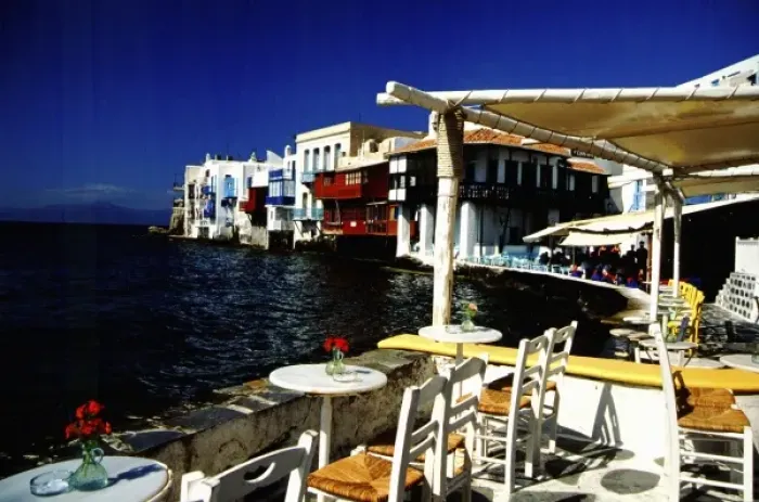 Framed Print : Greece, Aegean Sea, Mykonos. Seaside cafe on the Aegean Sea