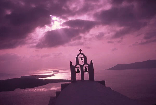 Greece, Aegean Sea, Santorini Island (Thera), Church steeple with evening light rays