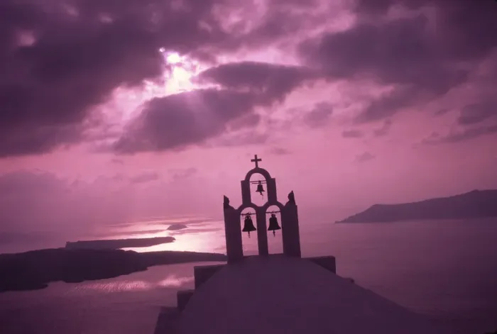 Framed Print : Greece, Aegean Sea, Santorini Island (Thera), Church steeple with evening light rays