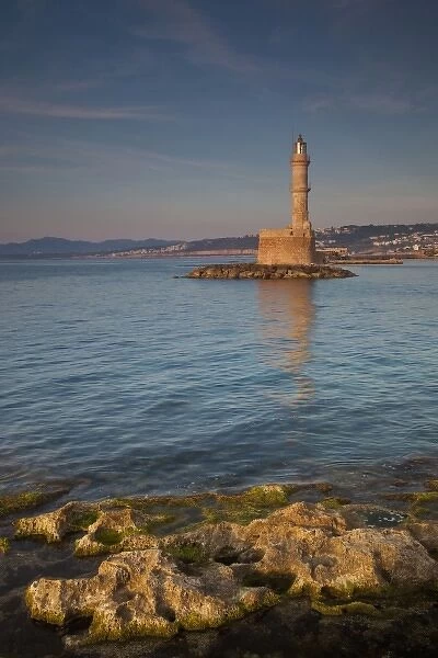 Greece, Crete, Chania, old harbor with Venetian Lighthouse in reflection
