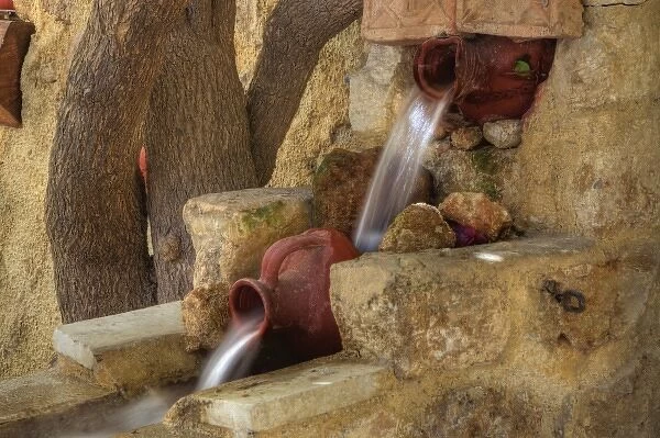 Greece, Crete, Chania, old town with clay pot fountain