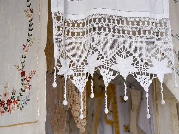 Greece, Crete. Lace and embroidery in shop in town of Kritsa. Lasithi Region