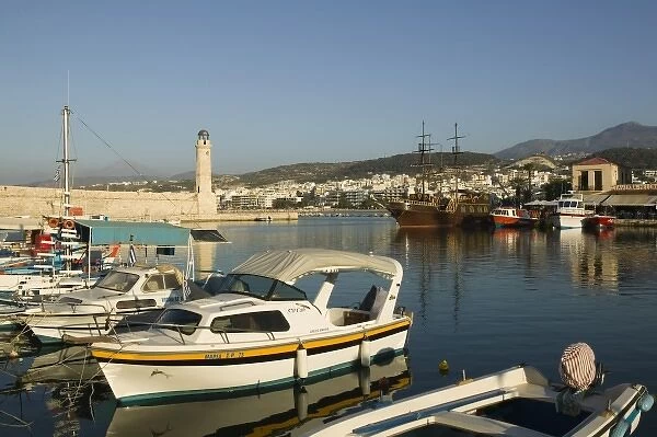 GREECE, CRETE, Rethymno Province, Rethymno: Venetian Harbor with lighthouse  /  Sunset