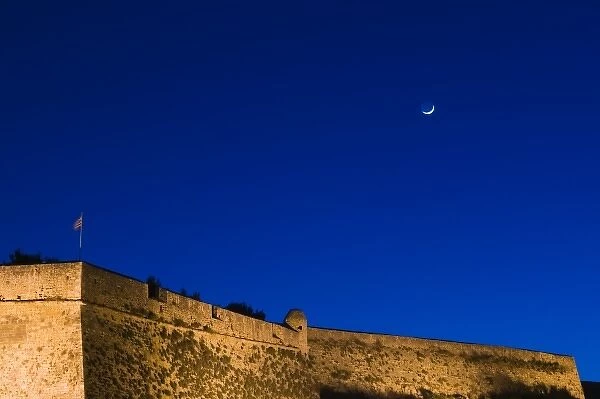GREECE, CRETE, Rethymno Province, Rethymno: 16th century Fortress & moonset  /  Dusk