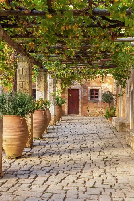 Framed Print : Greece, Crete, Rethymno. Venetian Baroque, 16th century Eastern Orthodox Monastery. The Holy Monastery of Arkadi. Cloister with grape arbor Framed Print : Greece, Crete, Rethymno. Venetian Baroque, 16th century Eastern Orthodox Monastery. The Holy Monastery of Arkadi. Cloister with grape arbor