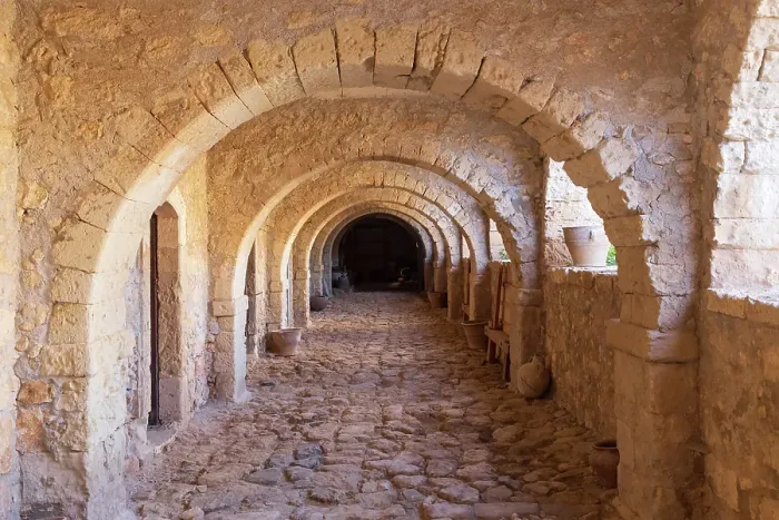 Framed Print : Greece, Crete, Rethymno. Venetian Baroque, 16th century Eastern Orthodox Monastery. The Holy Monastery of Arkadi. Arched stone passageway