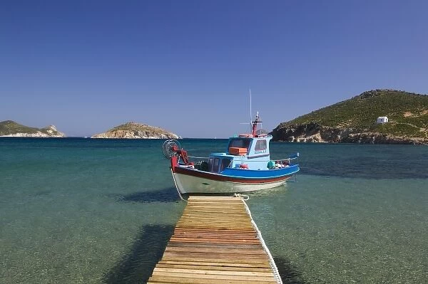 GREECE, Dodecanese Islands, PATMOS, Kampos: Shore view with small boat  /  Livadi Geranos