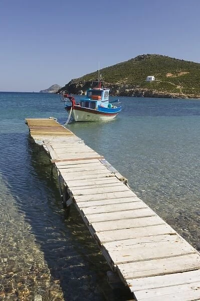 GREECE, Dodecanese Islands, PATMOS, Kampos: Shore view with small boat  /  Livadi Geranos