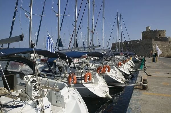 GREECE, Dodecanese Islands, RHODES, Rhodes Town: Mandraki Harbor with boats  /  Daytime