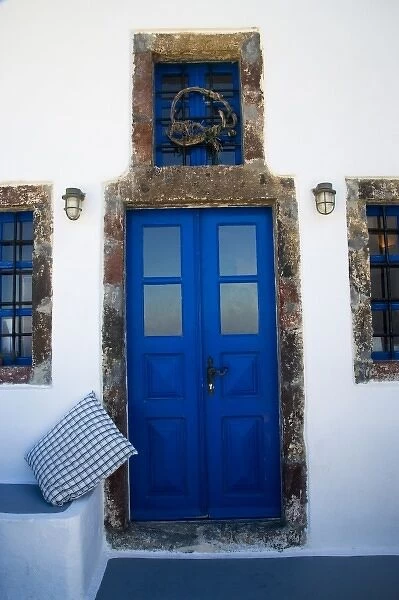 Greece and Greek Island of Santorini from the small town of Imerovigli doorway leading