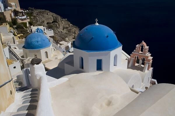 Greece and Greek Island of Santorini town of Oia with Blue Domed Churches with white