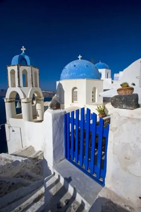 Framed Print : Greece and Greek Island of Santorini town of Oia with Blue Domed Churches with white