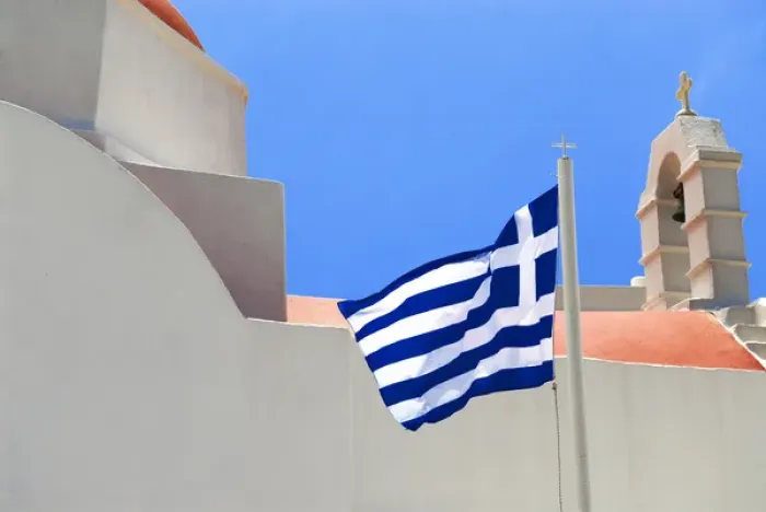 Framed Print : Greece; Mykonos; Chora. The Greek flag flys over the Island of Mykonos Framed Print : Greece; Mykonos; Chora. The Greek flag flys over the Island of Mykonos