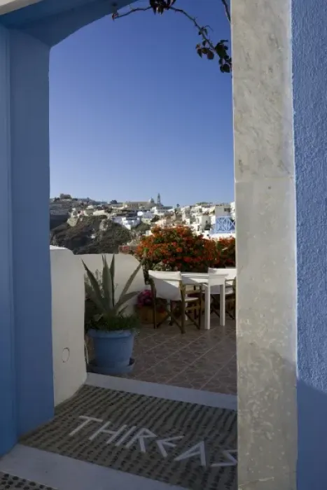 Framed Print : Greece, Santorini. Doorway to balcony tables at Thireas Restaurant