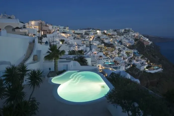 Framed Print : Greece, Santorini, Firostefani. Early evening view of cliffside villas with lit swimming Framed Print : Greece, Santorini, Firostefani. Early evening view of cliffside villas with lit swimming
