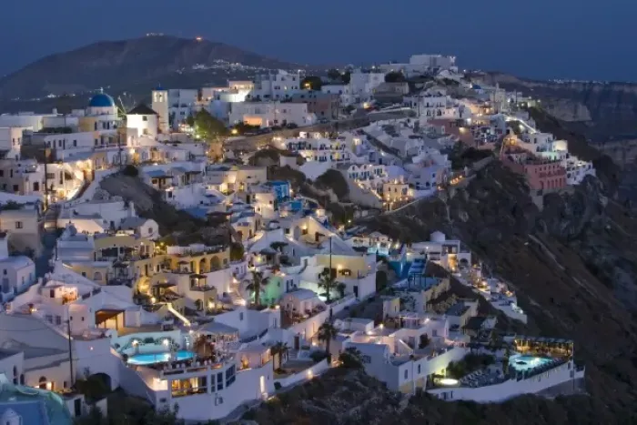 Framed Print : Greece, Santorini, Firostefani. Early evening view of cliffside villas with lights coming Framed Print : Greece, Santorini, Firostefani. Early evening view of cliffside villas with lights coming