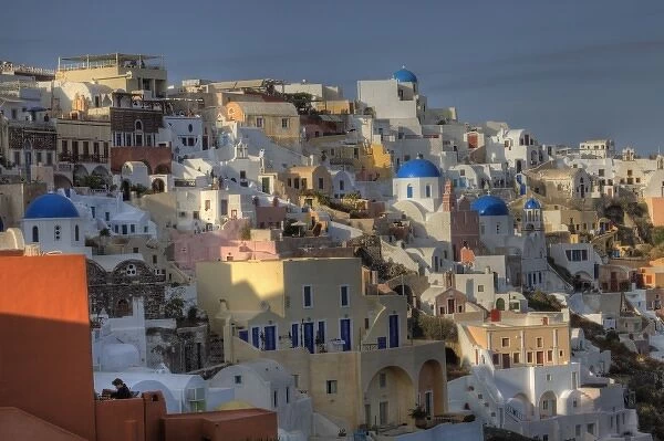 Greece, Santorini, Oia town in evening light with all the colorful buildings