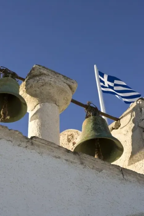 Framed Print : Greece, Santorini, Thira, Oia. Bells with Greek flag in background Framed Print : Greece, Santorini, Thira, Oia. Bells with Greek flag in background