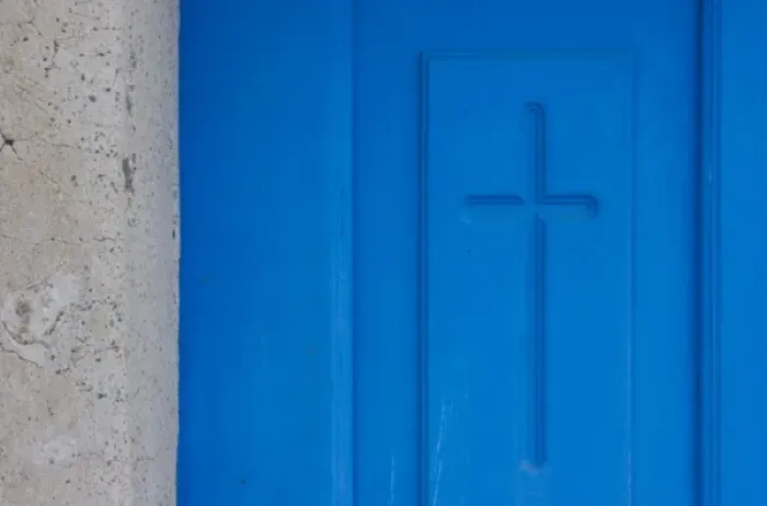 Framed Print : Greece, Santorini, Thira, Oia. Christian cross symbol engraved in blue door Framed Print : Greece, Santorini, Thira, Oia. Christian cross symbol engraved in blue door