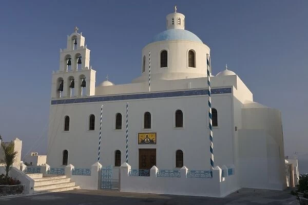 Greece, Santorini, Thira, Oia. Large Greek Orthodox church in main square with dome and bell tower