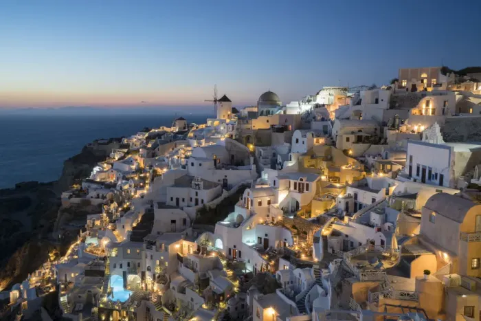 Framed Print : Greece, Santorini. The village of Oia glowing in the post-sunset light as the town s Framed Print : Greece, Santorini. The village of Oia glowing in the post-sunset light as the town s