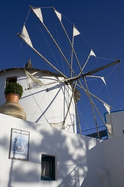 Greece, Santorini. White windmill against blue sky