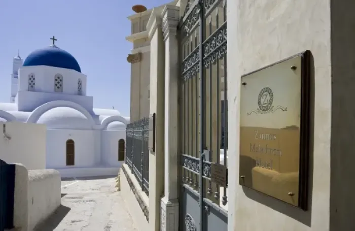 Framed Print : Greece, Santorini. Zannos Melathron Hotel with Greek Orthodox church in background Framed Print : Greece, Santorini. Zannos Melathron Hotel with Greek Orthodox church in background