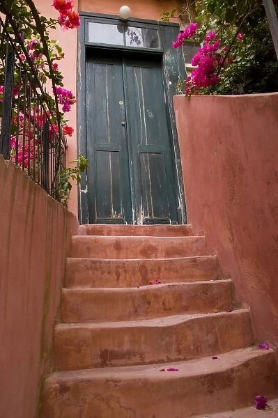 Greek Island of Crete and old town of Chania Colorful stairways up to a bluish doorway