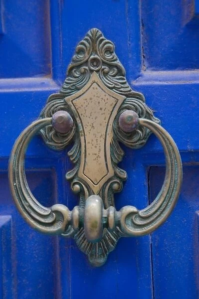 Greek Island of Crete and old town of Chania old blue doorway with metal knocker