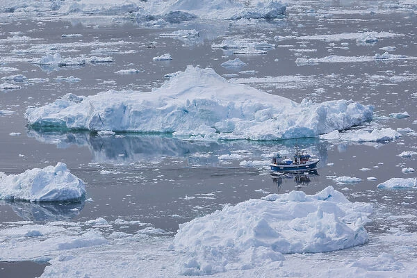 Greenland, Disko Bay, Ilulissat, elevated view of floating ice and fishing boat