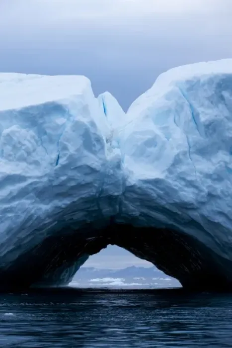 Framed Print : Greenland, Ilulissat, Arch formed within melting iceberg grounded near face of Jakobshavn