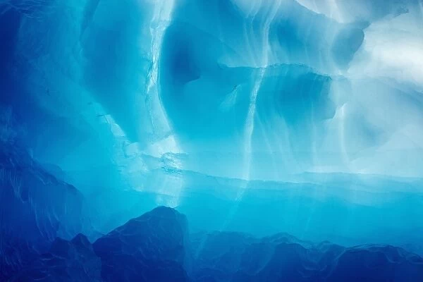 Greenland, Ilulissat, Blue ice of backlit iceberg calved from Eqip Glacier into Disko