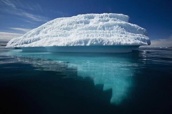 Greenland, Ilulissat, Submerged base of melting iceberg from Jakobshavn Glacier floating