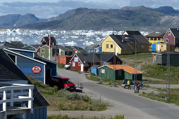Greenland, Narsaq. Colorful cottages line the road to Qajaq Harbor in Narsaq, Greenland