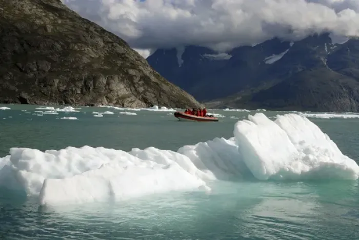 Framed Print : Greenland, Qooroq Fjord. A rubber raft navigates through a sea of icebergs on Qooroq Framed Print : Greenland, Qooroq Fjord. A rubber raft navigates through a sea of icebergs on Qooroq