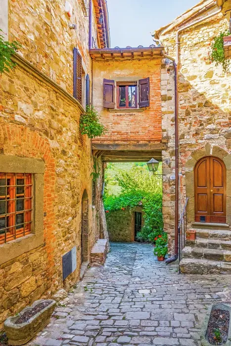 Framed Print : Greve in Chianti, Tuscany, Italy. Vertical street view of ancient buildings showing shuttered windows and stonework walls Framed Print : Greve in Chianti, Tuscany, Italy. Vertical street view of ancient buildings showing shuttered windows and stonework walls