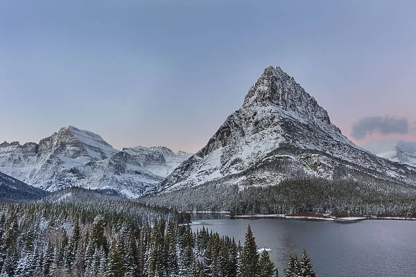 Grinnell Point and Mount Gould over Swiftcurrent Lake in ealry winter in Glacier National Park